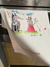 Load image into Gallery viewer, Tea-towel hanging on oven door. Colourful and practical.
